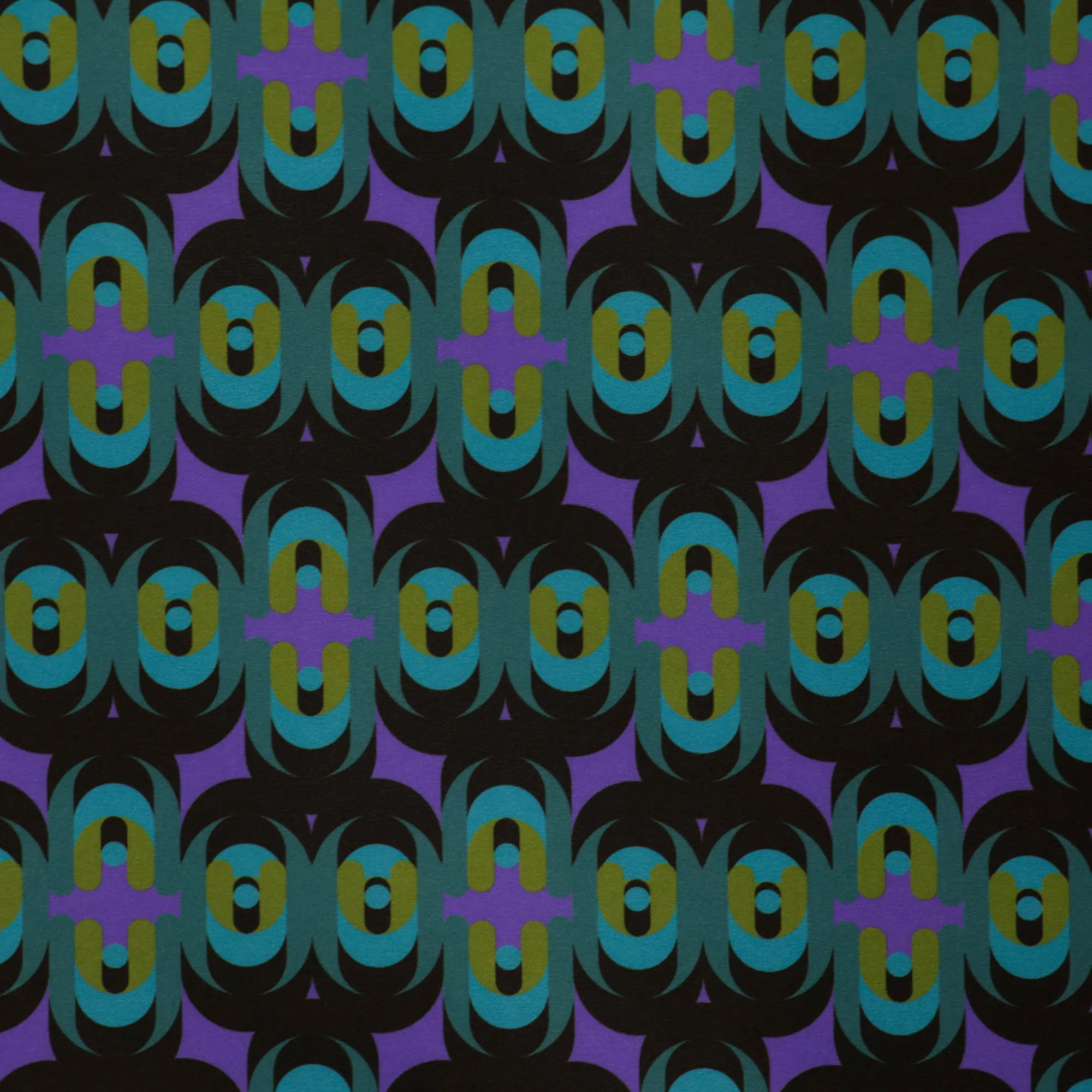 Zware polyester stretch groen-paars abstract patroon  - knipmode