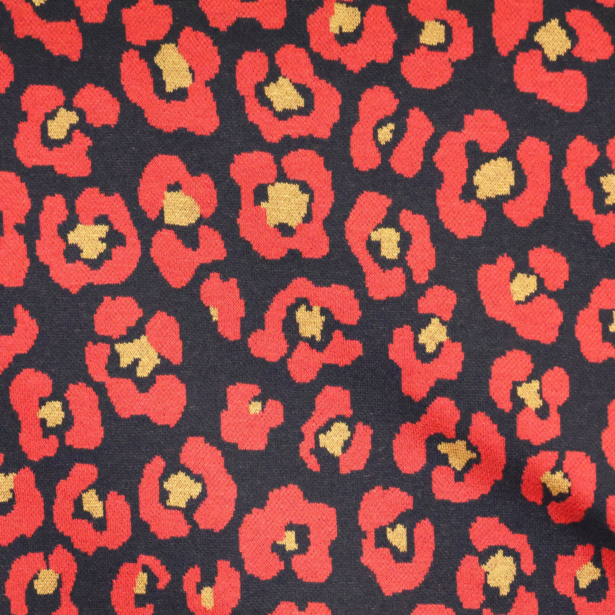 Jacquard tricot met rode pantervlekken