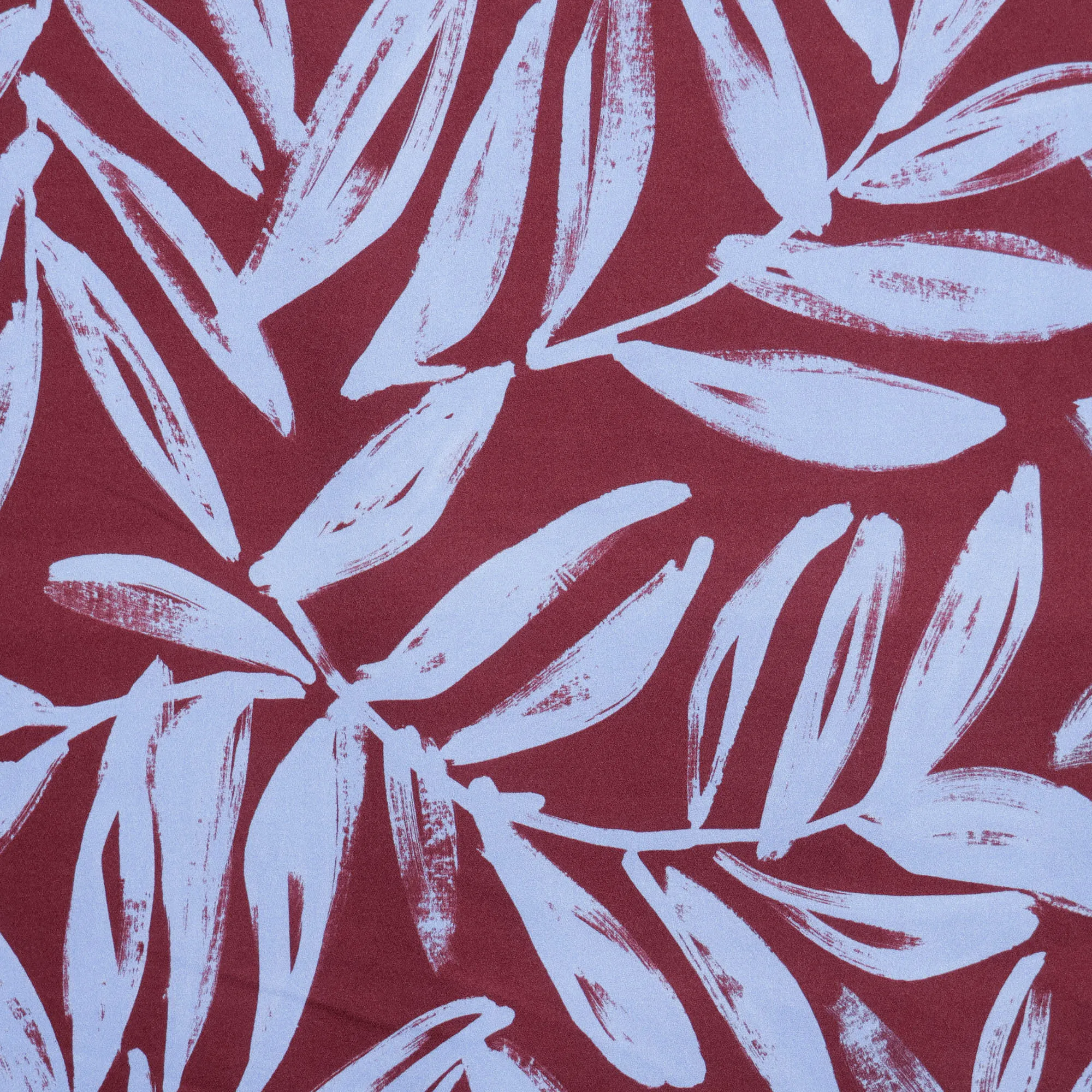 Viscose crêpe bruin met lichtblauw bloemenpatroon