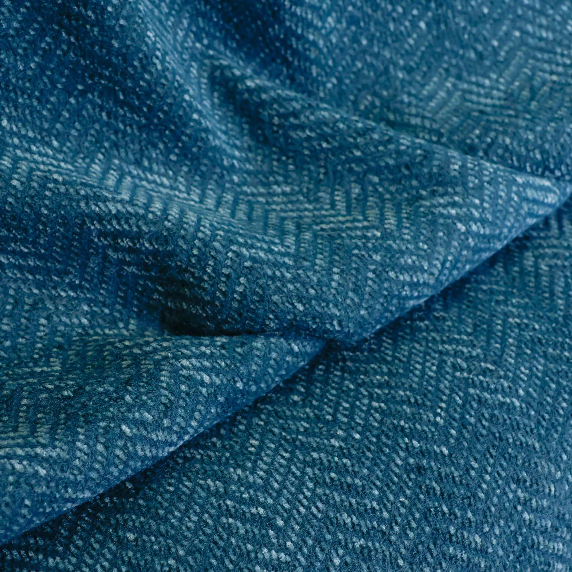Bouclé turquoise met visgraatpatroon