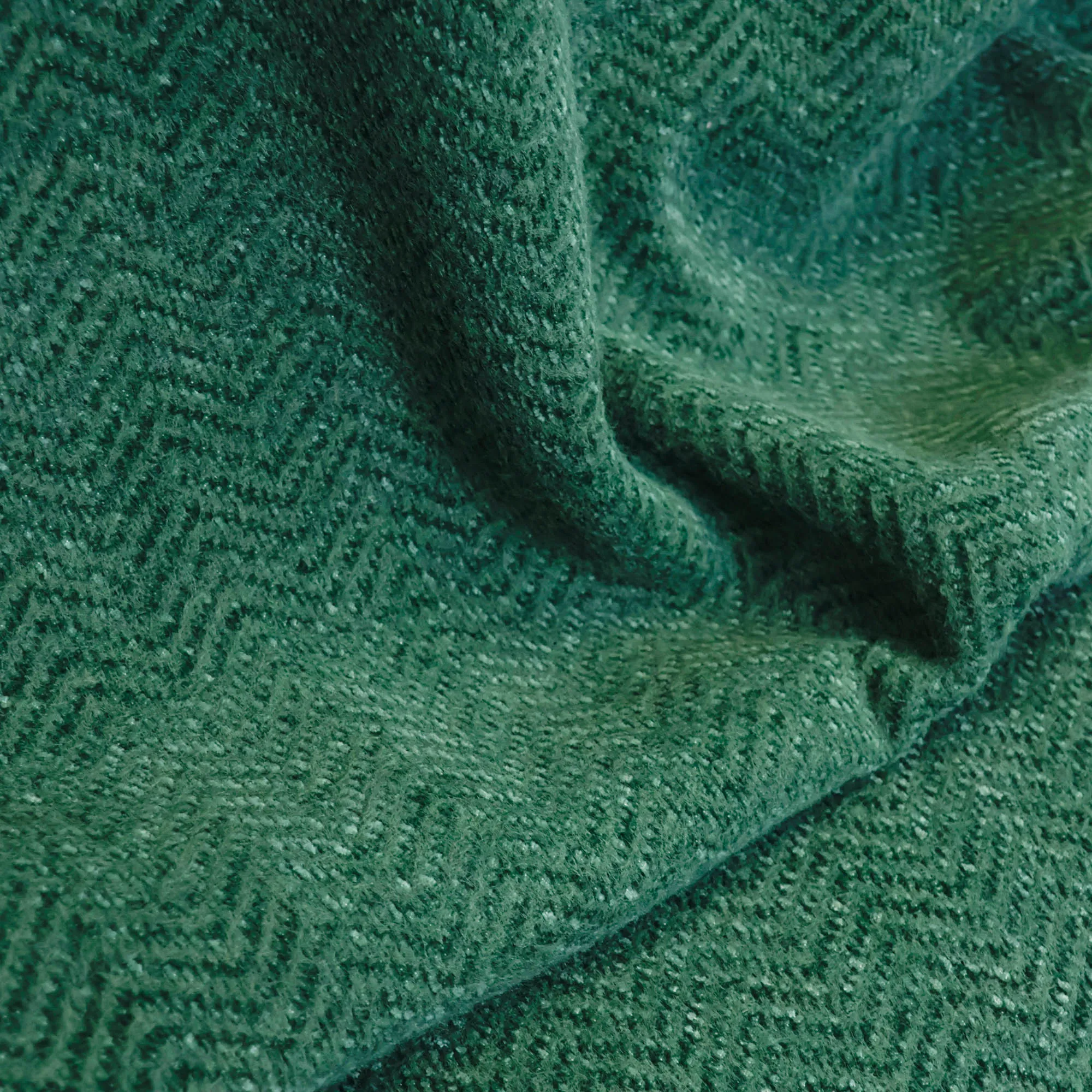 Bouclé groen met visgraatpatroon