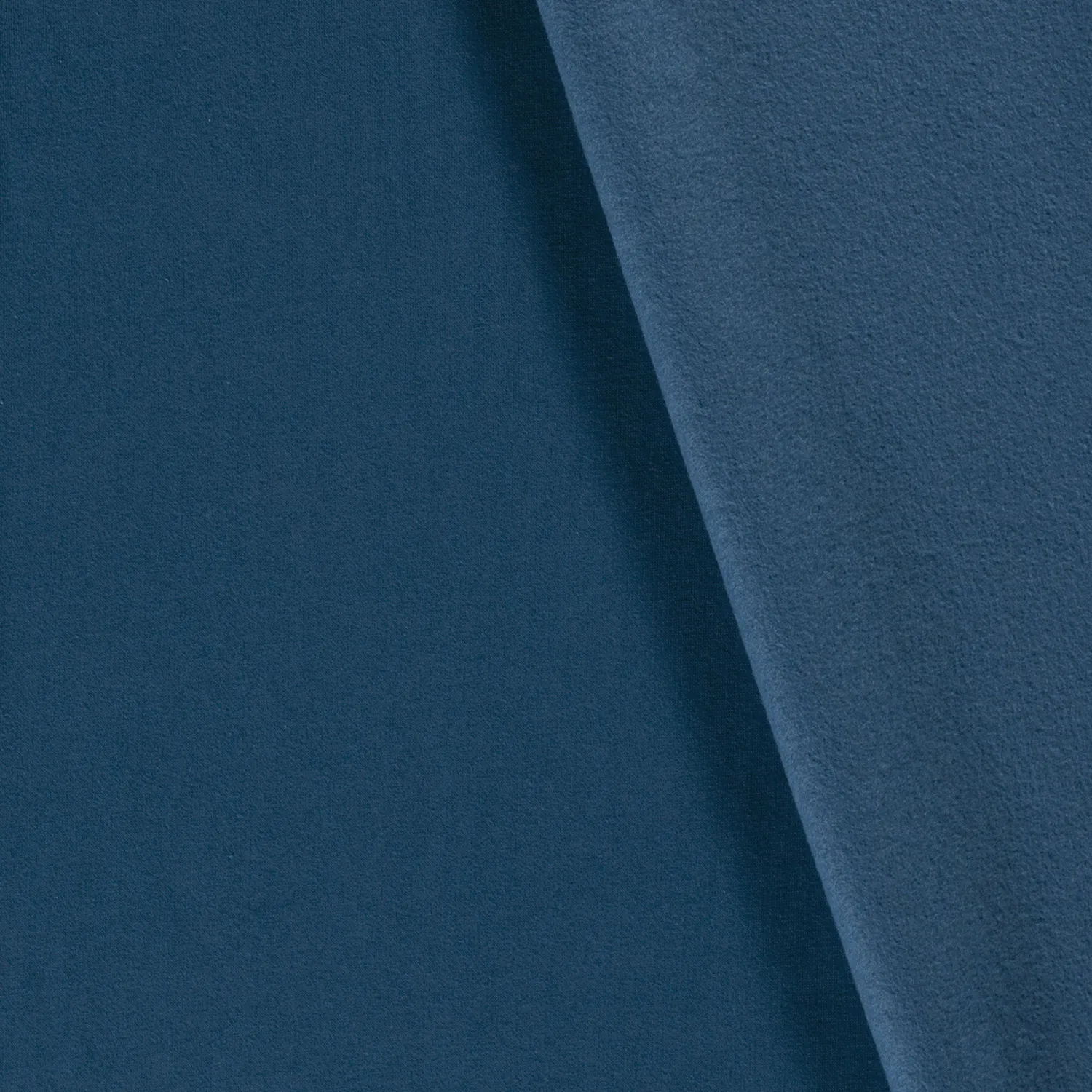 Gebrushte sweaterstof pauw blauw