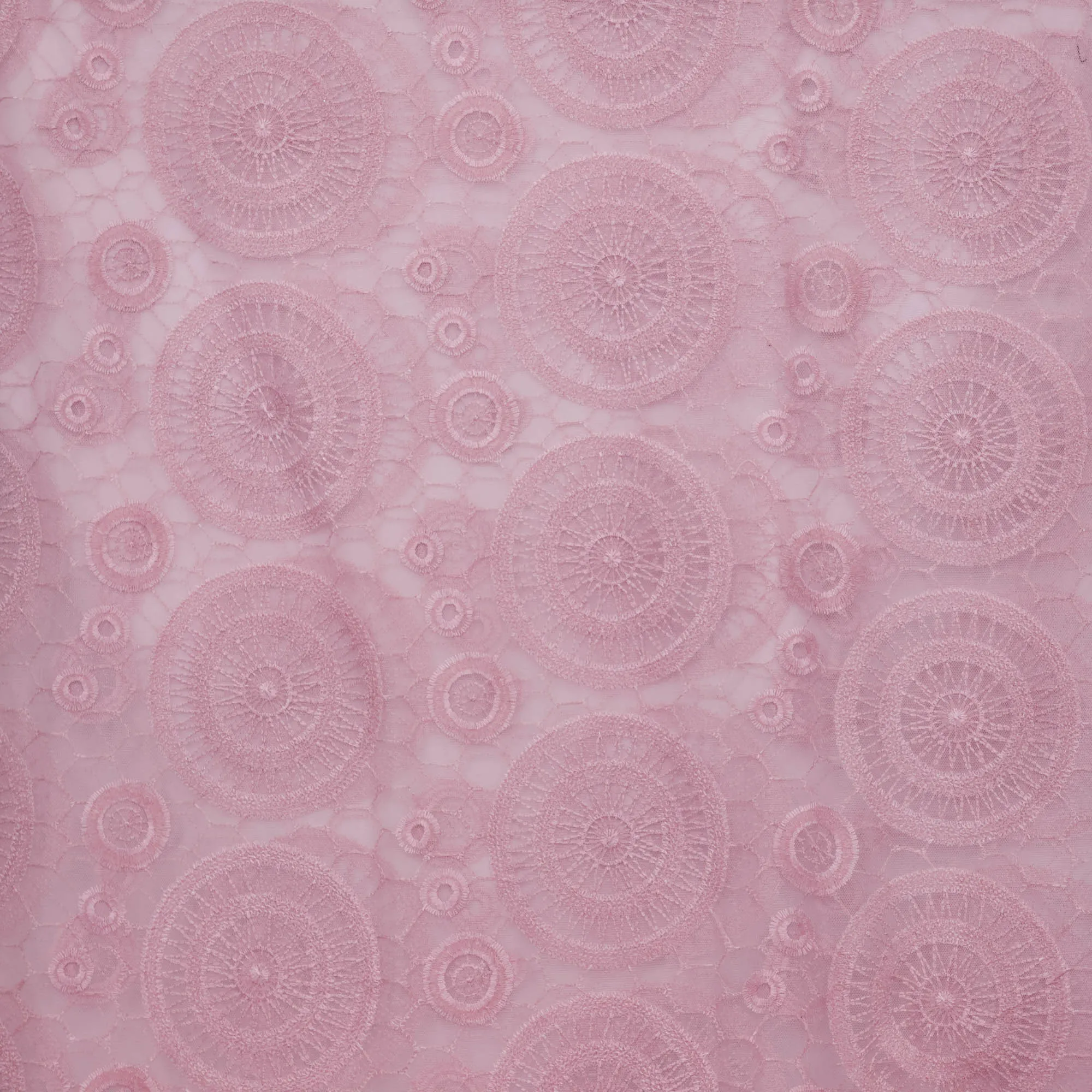 Broderie tule oud roze met ronde figuren