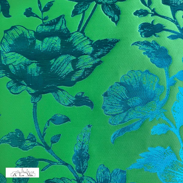 Polyester twill groen met glanzende blauwe bloemen