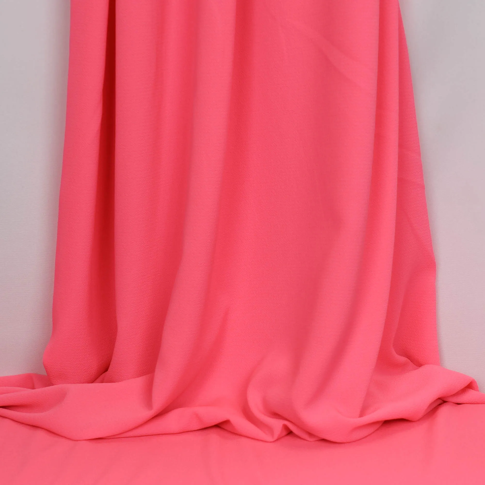 Polyester bubble crêpe fluo roze