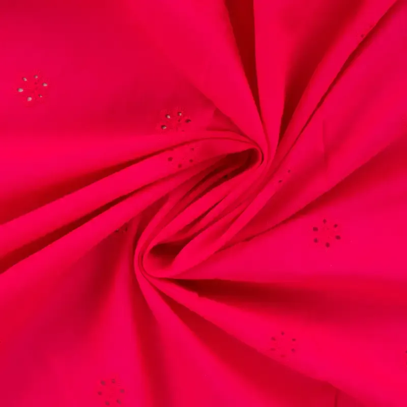 Broderie fuchsia met bloemetjes en afgewerkte boord