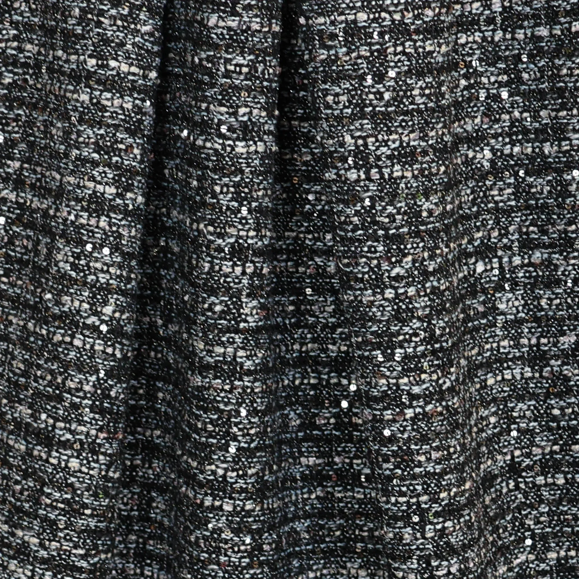 Chanel bouclé zwart met gouden opgenaaide pailletten