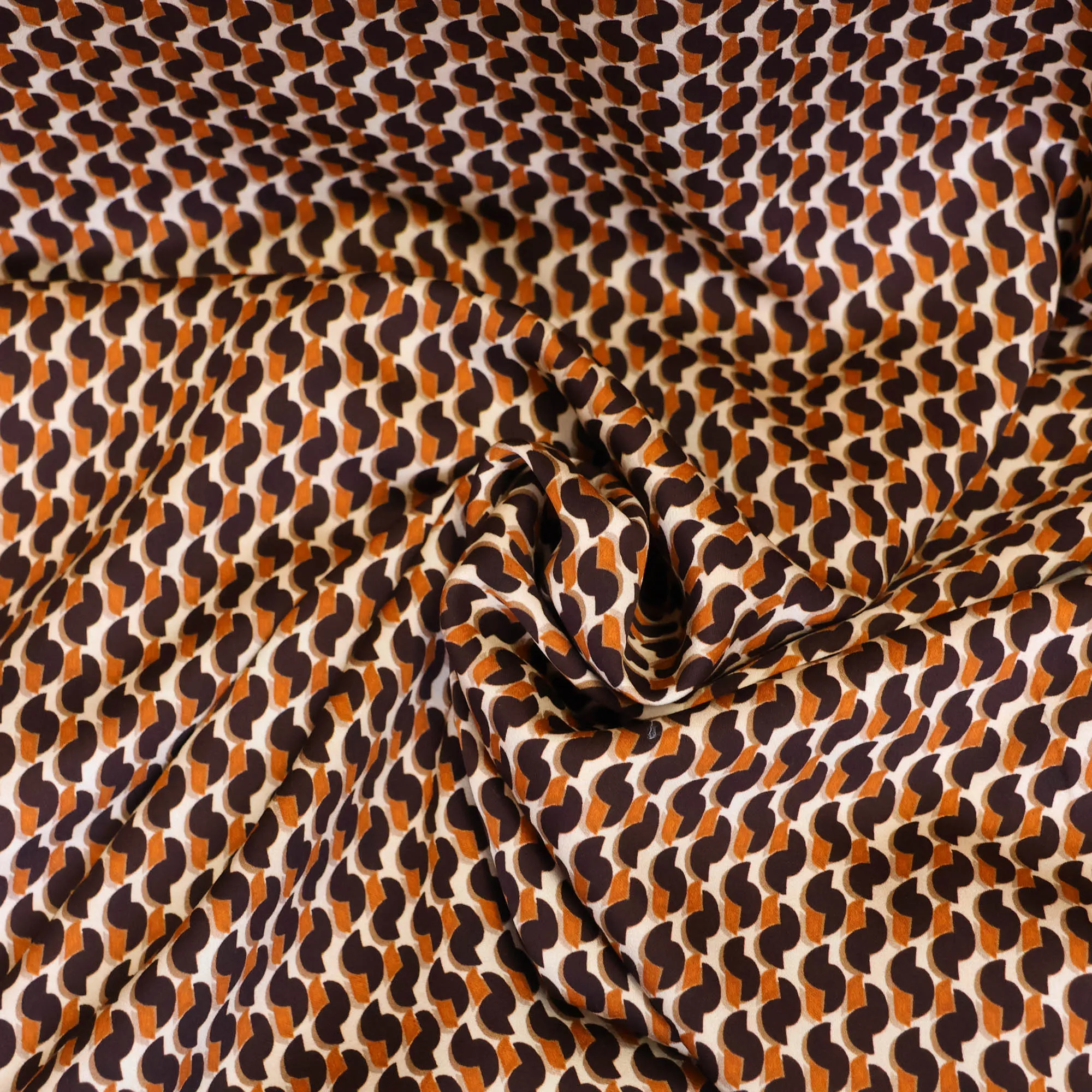 Viscose met turquoise en oranje print