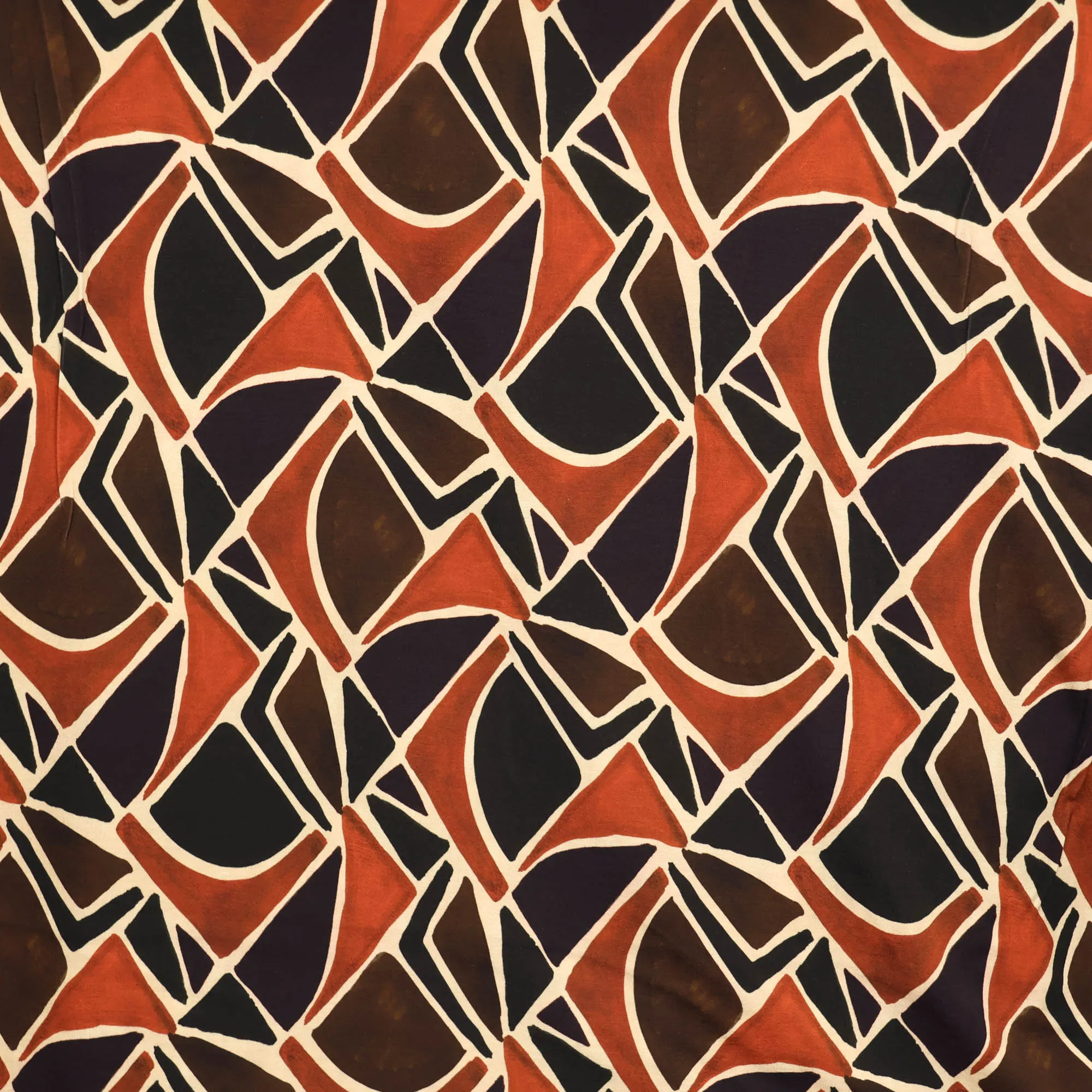 Viscose nylon tricot met oranje/bruine abstracte print