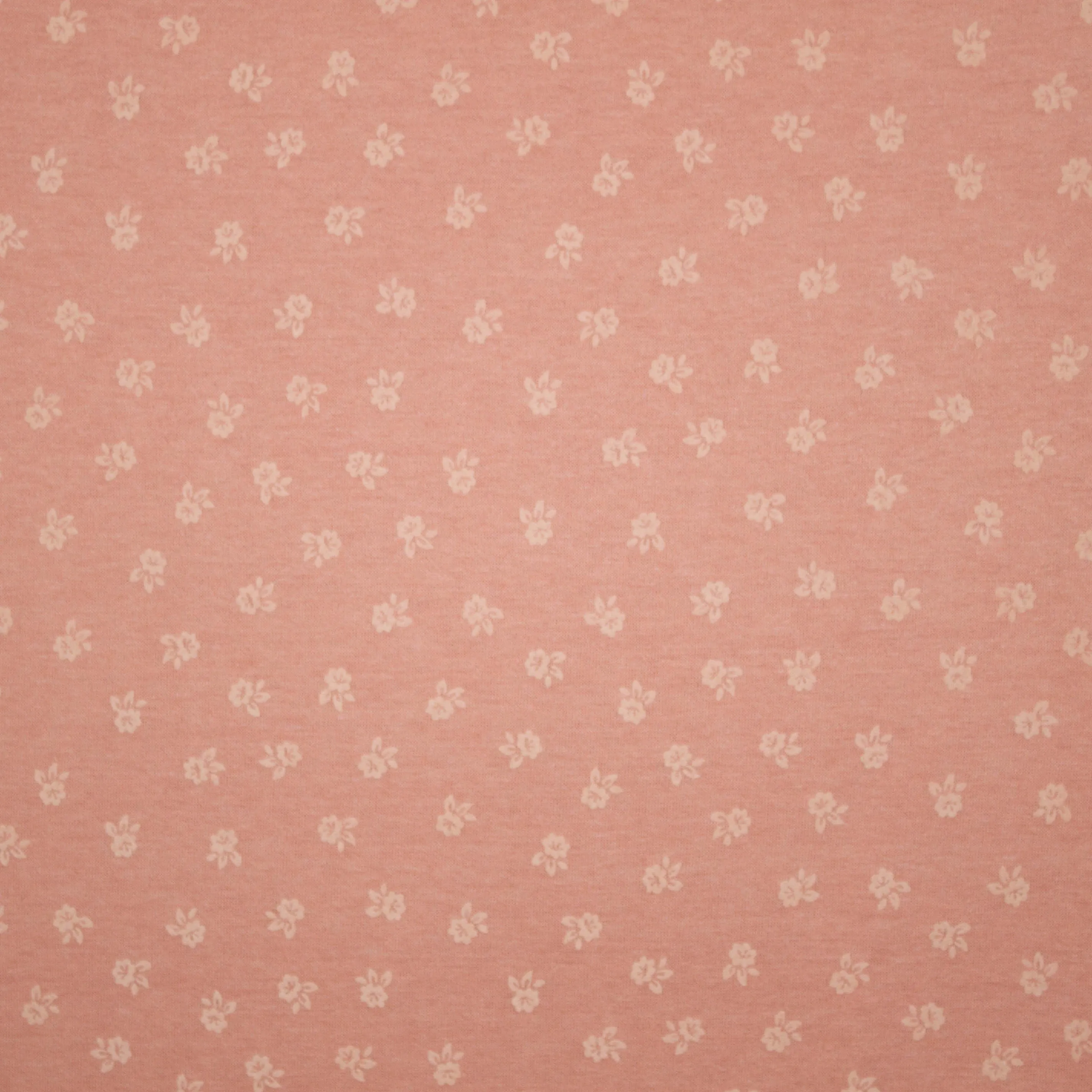 Roze gebreide stof met bloemetjes