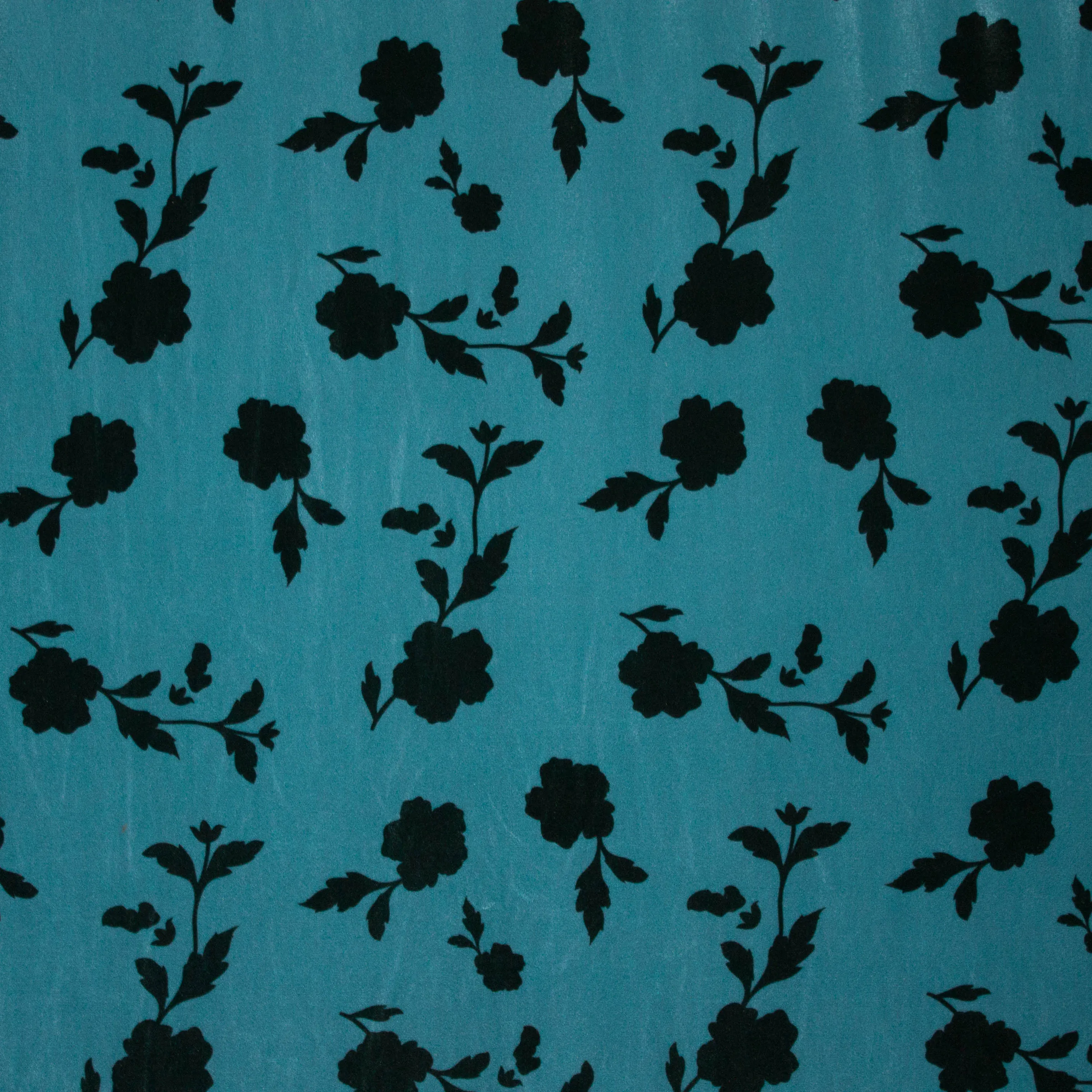 Stretch velours/fluweel in blauw met bladmotief