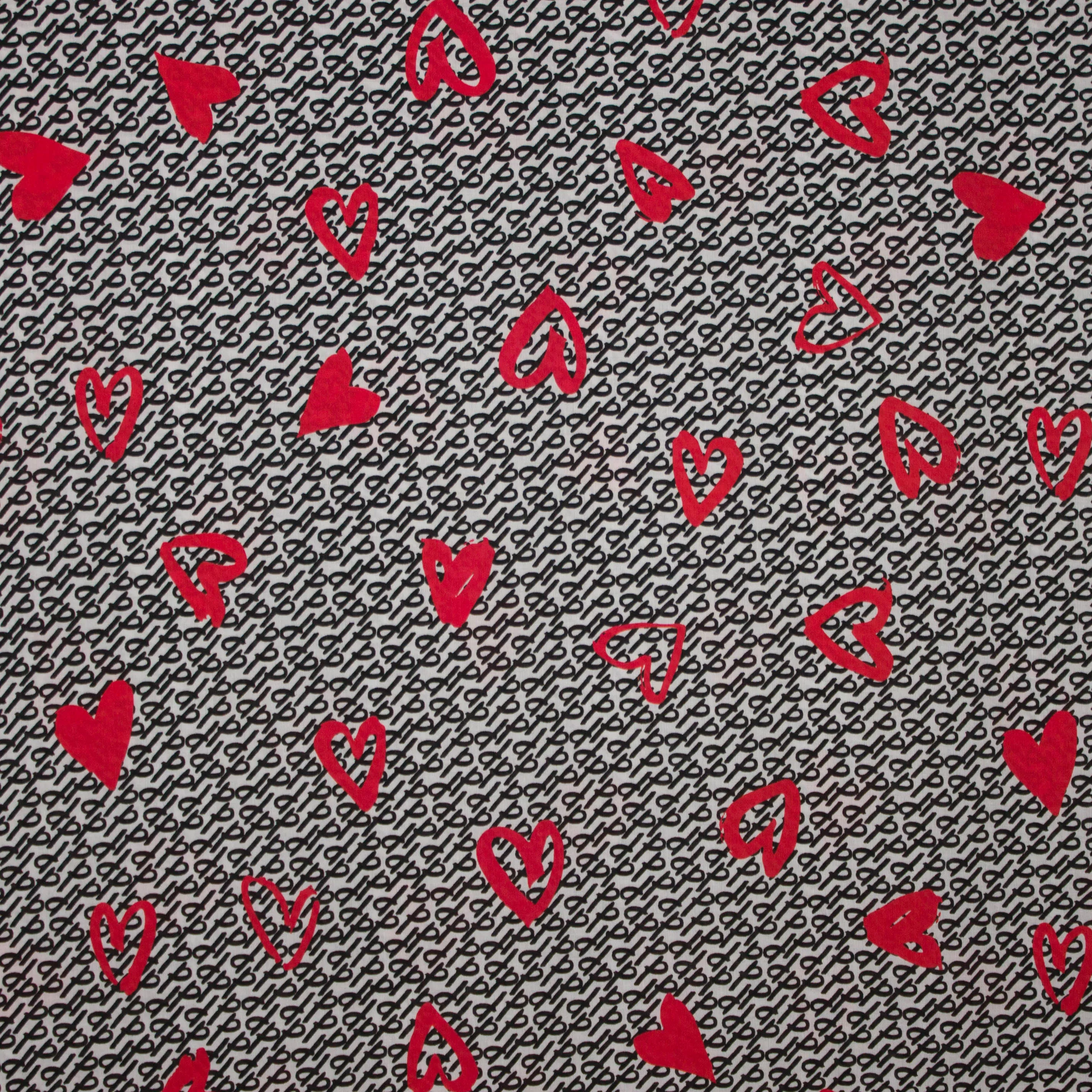 Witte viscose met zwart abstract motief en rode harten