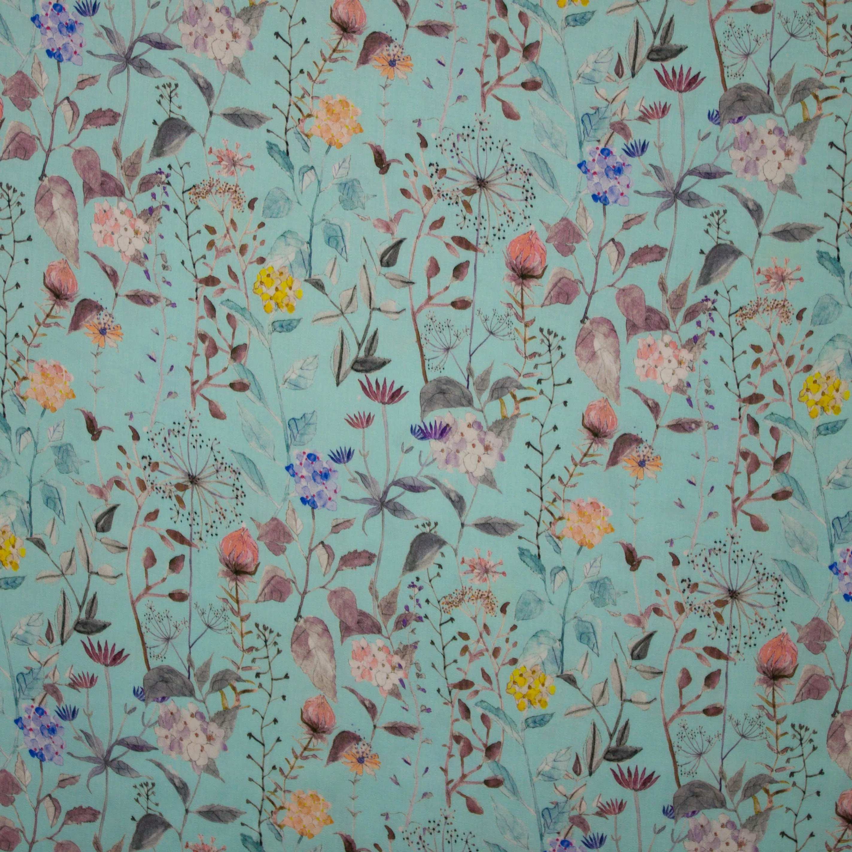 Turquoise Viscose met bloemen bedrukt
