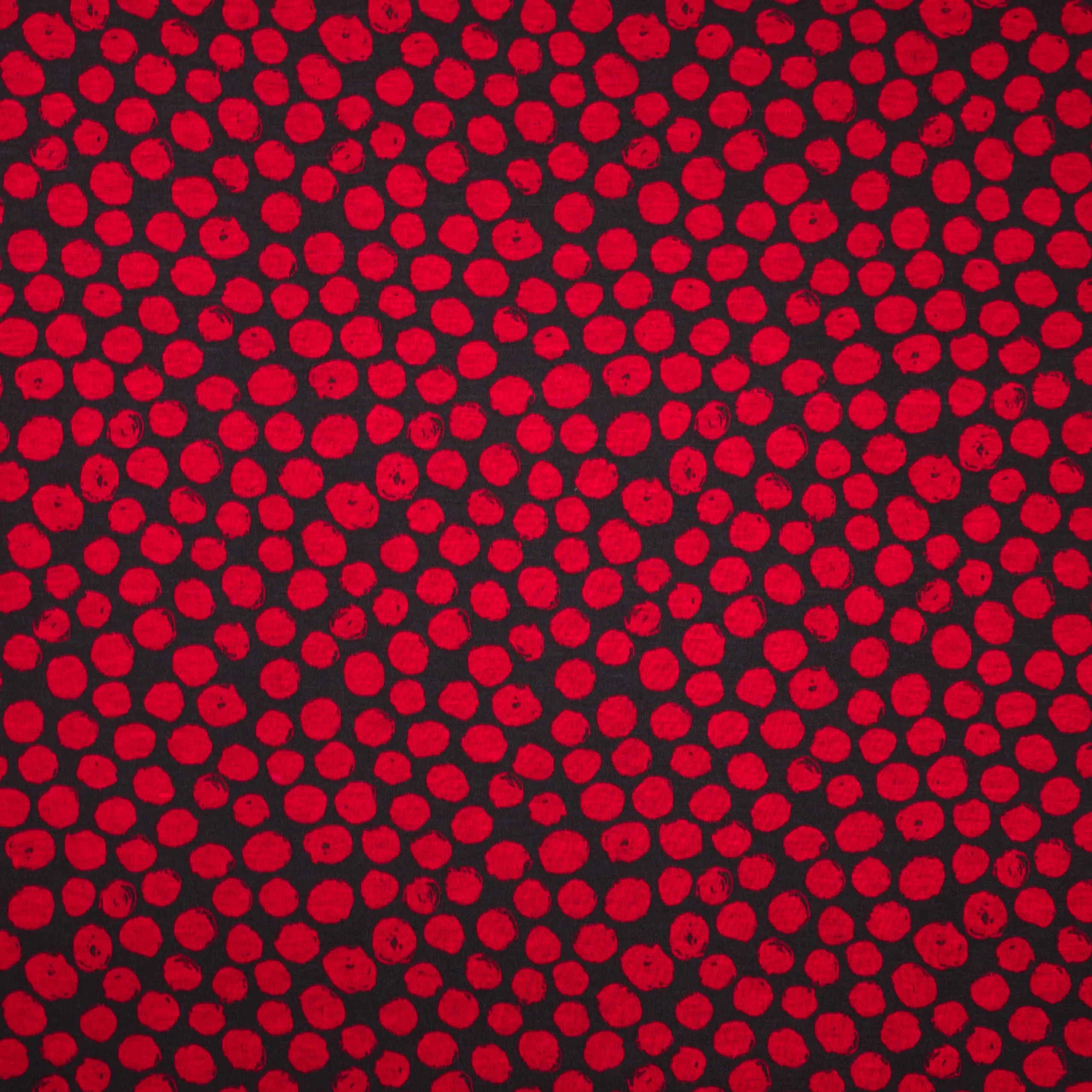 Zwarte polyester / viscose tricot met rode bollen van 'Stitched By You'