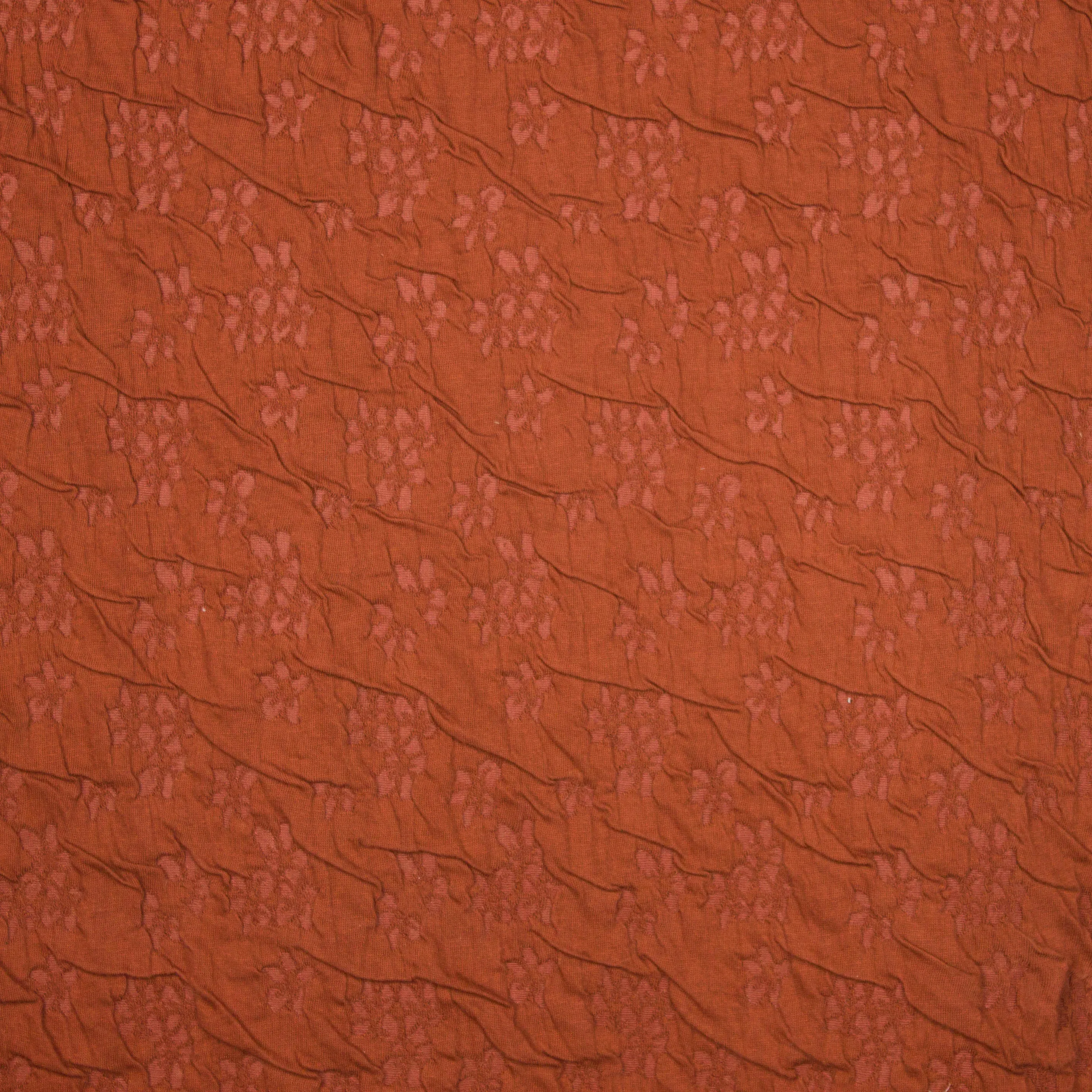 Roestkleurige  viscose structuurtricot met een fijn bloemetjes motiefje