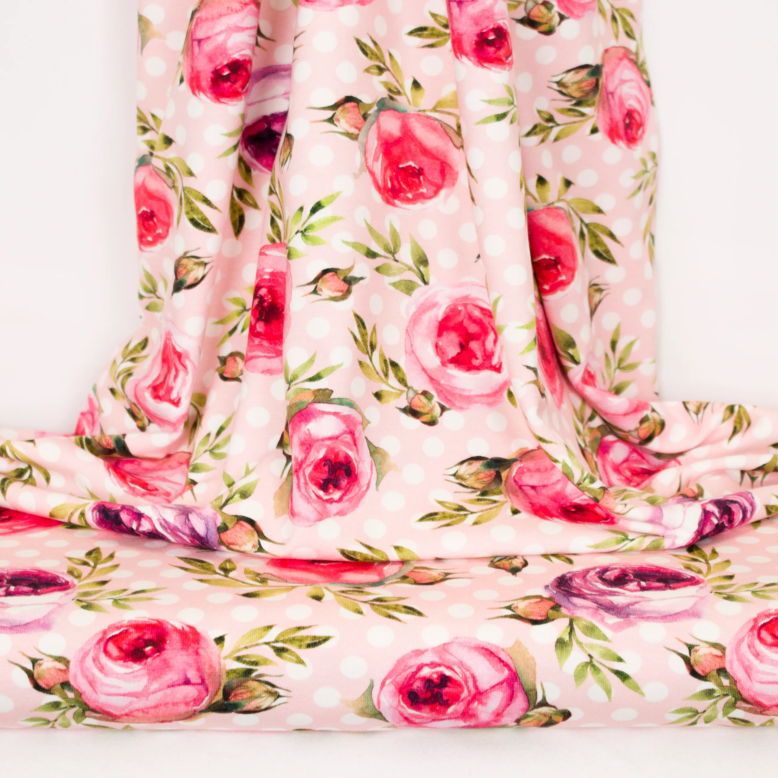 Tricot roos met witte stippen en rozen