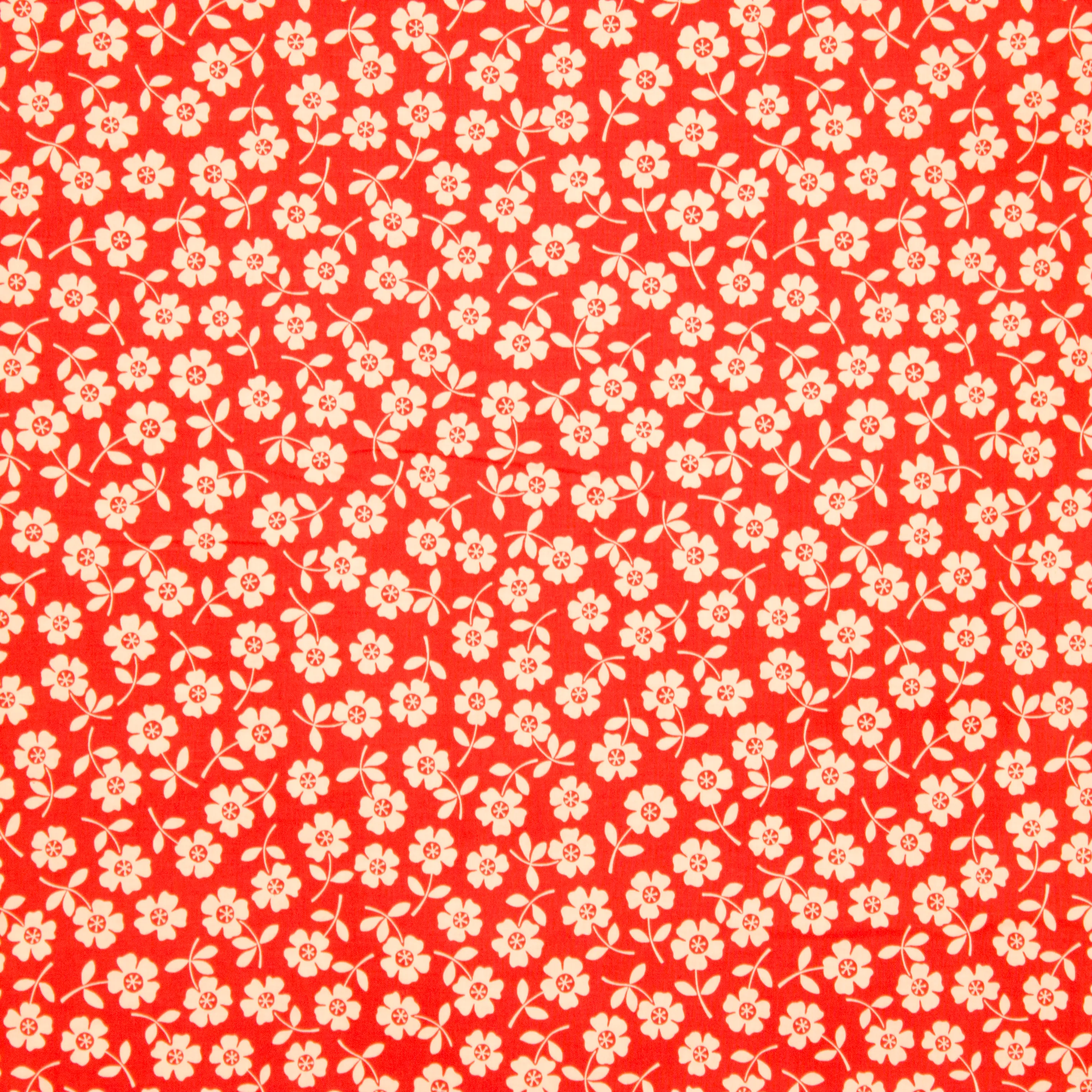 Oranje katoen met witte bloemen