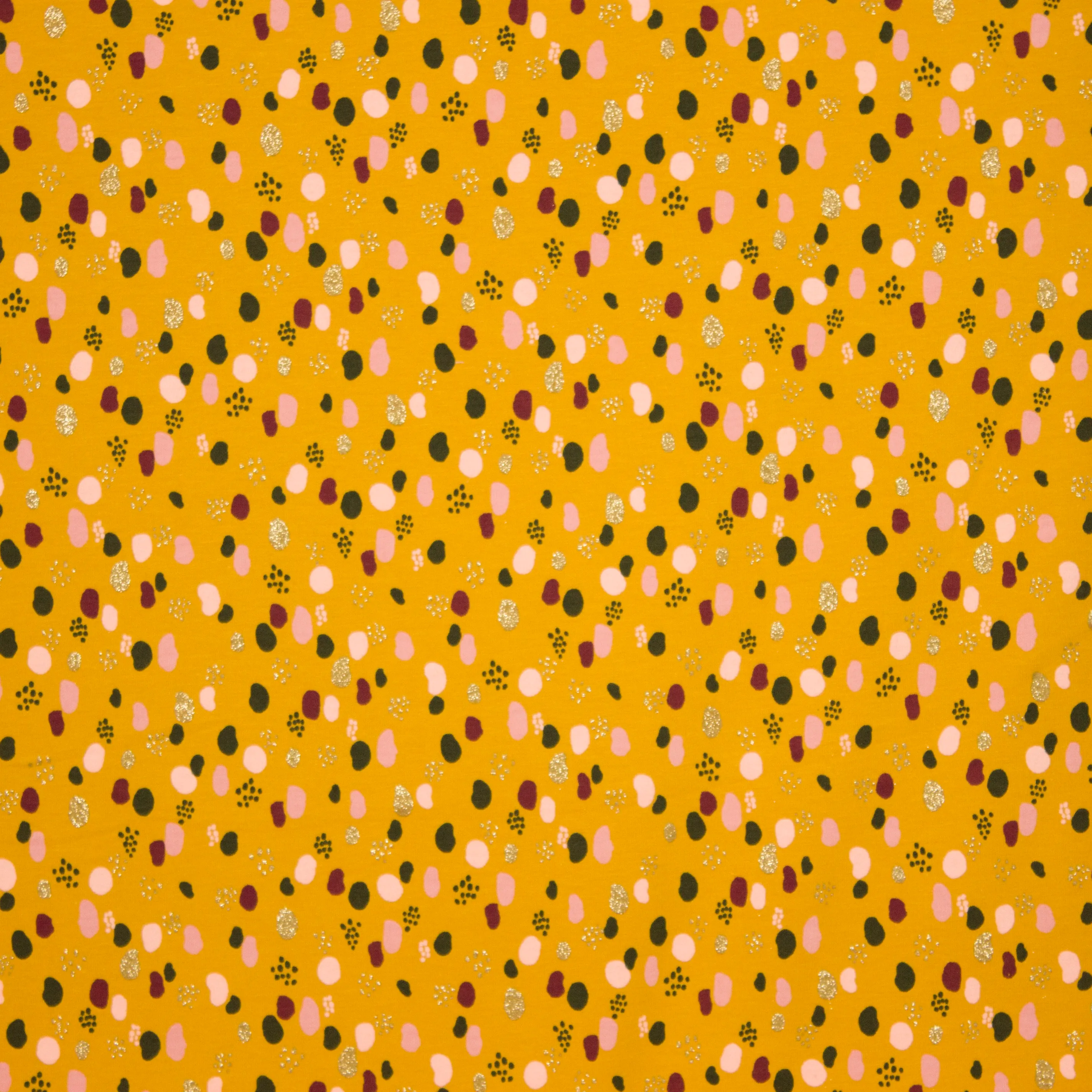 Tricot oker met stippen en glitter van Poppy