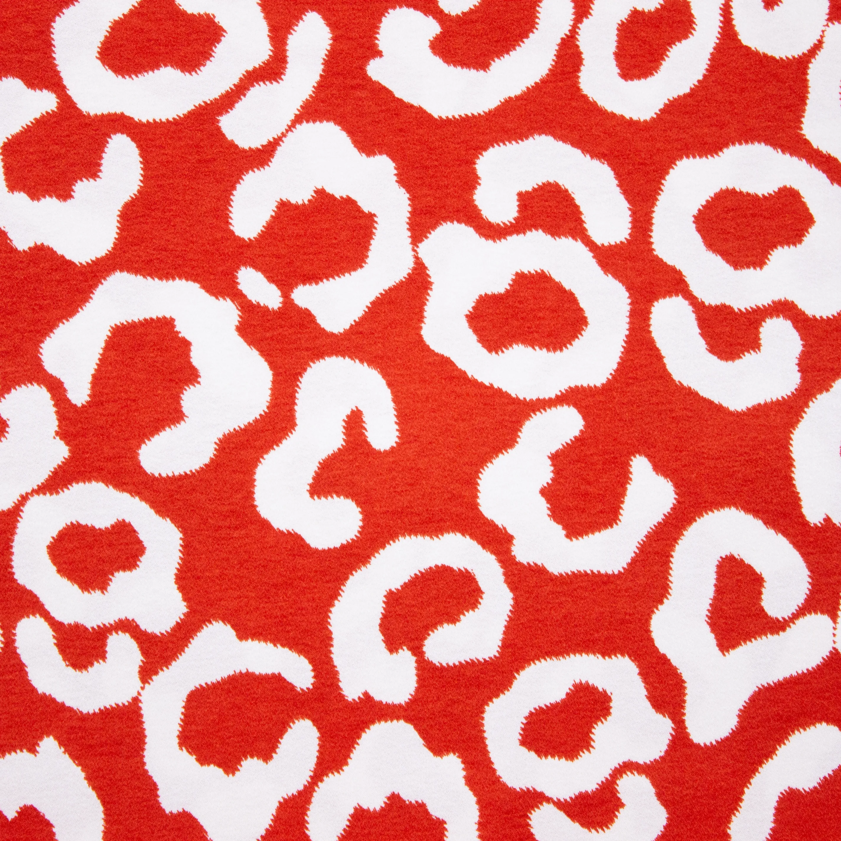 Viscose tricot rood met witte pantervlekken