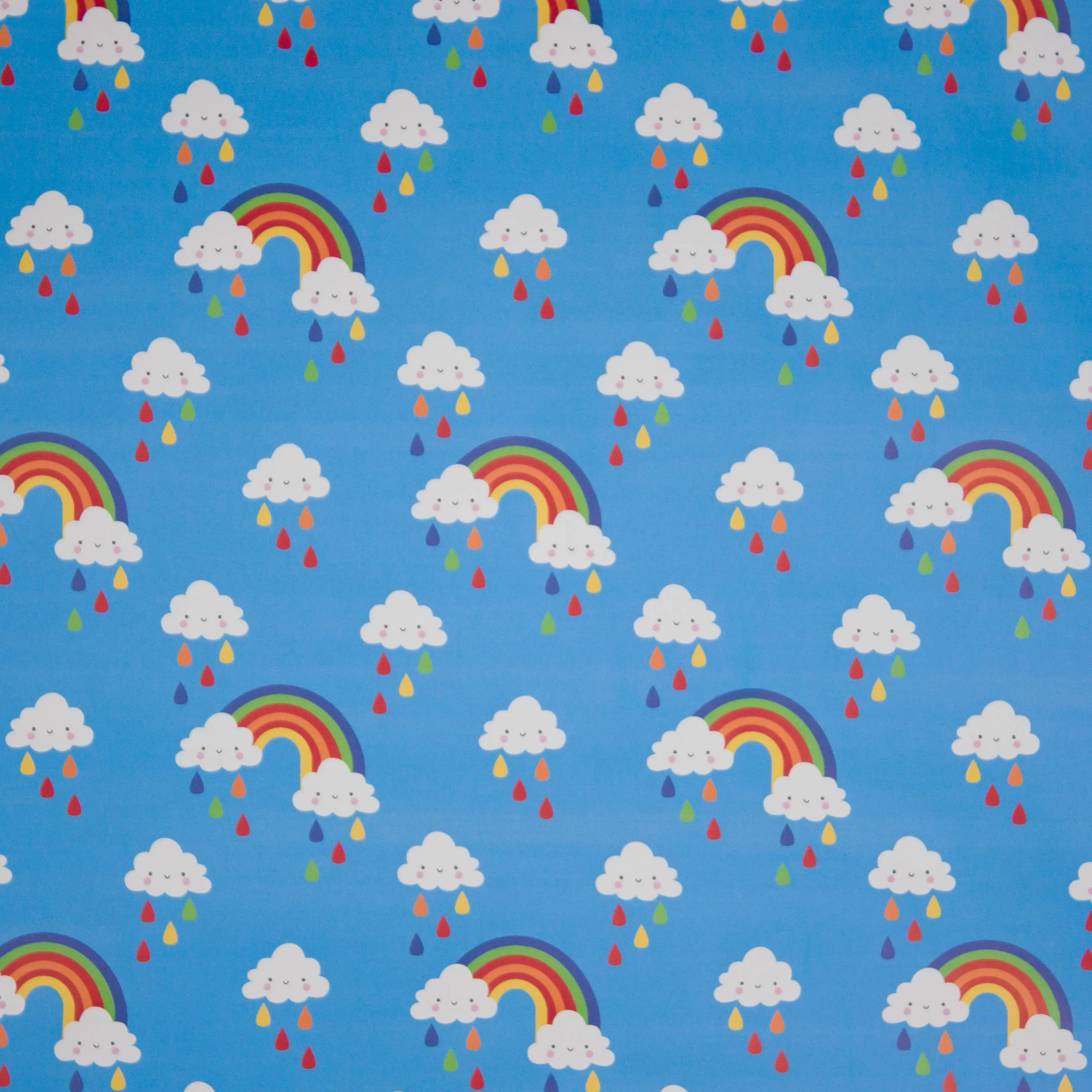 Regenjas stof in blauw met regenbogen en wolkjes