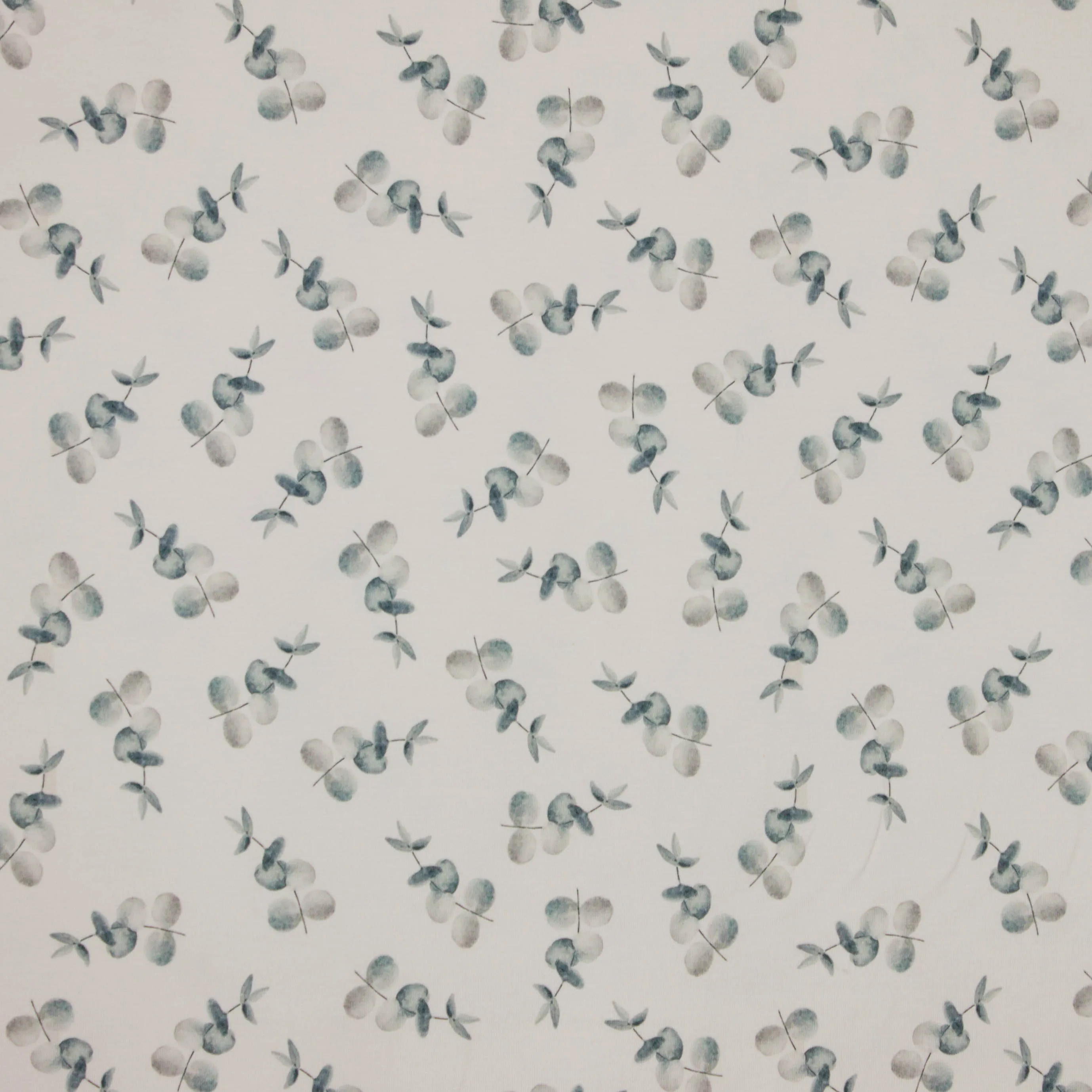 Ecru tricot met blaadjes motief van family fabrics