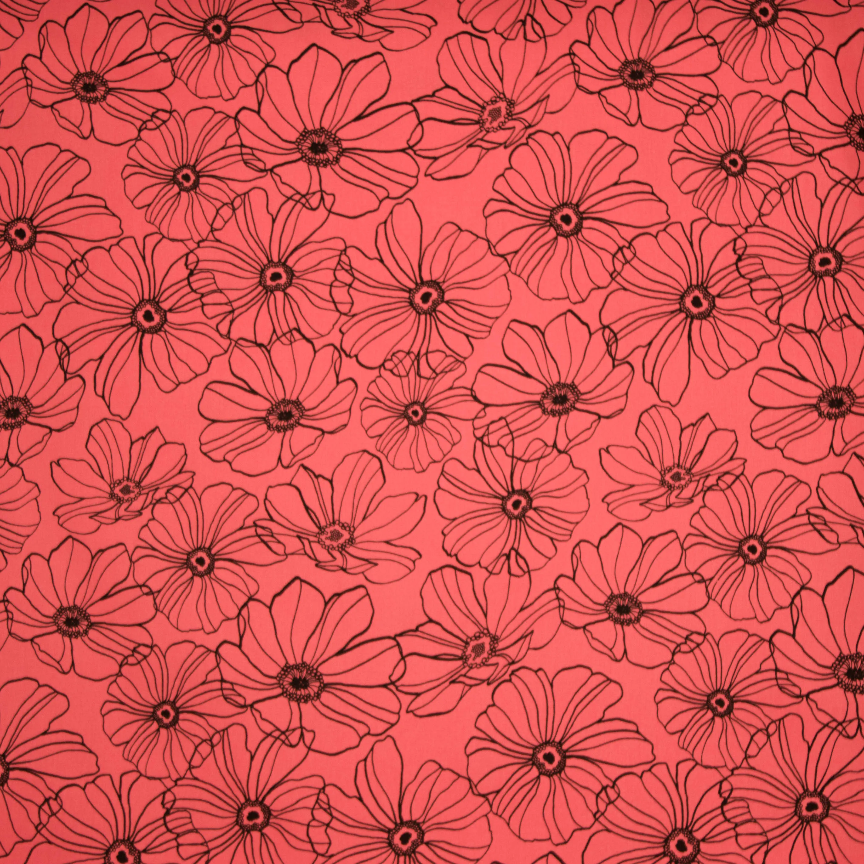 Koraalkleurige rekbare katoen met zwarte bloemen van Penelope