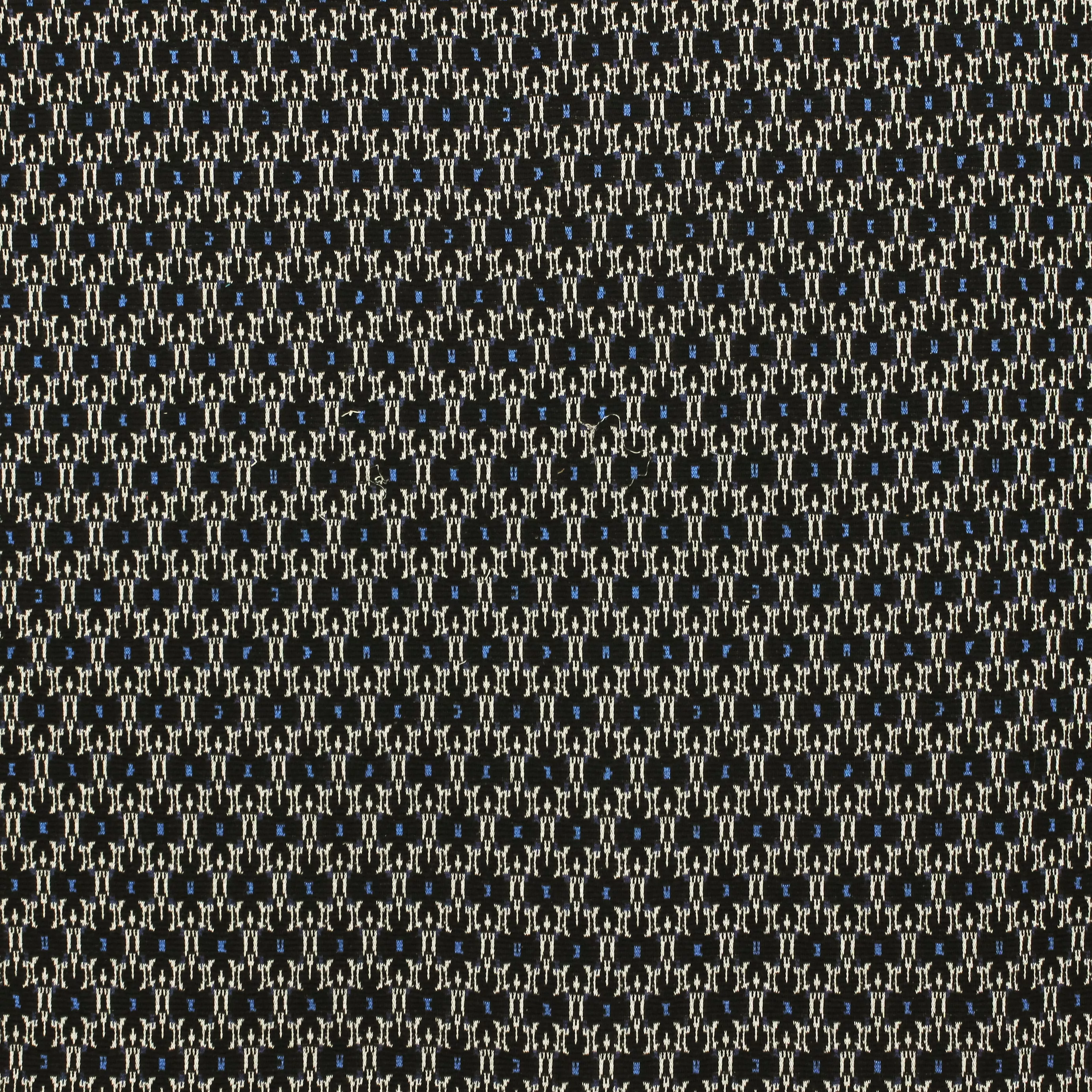 Zwarte gebreide stof met abstract motiefje in blauw en wit