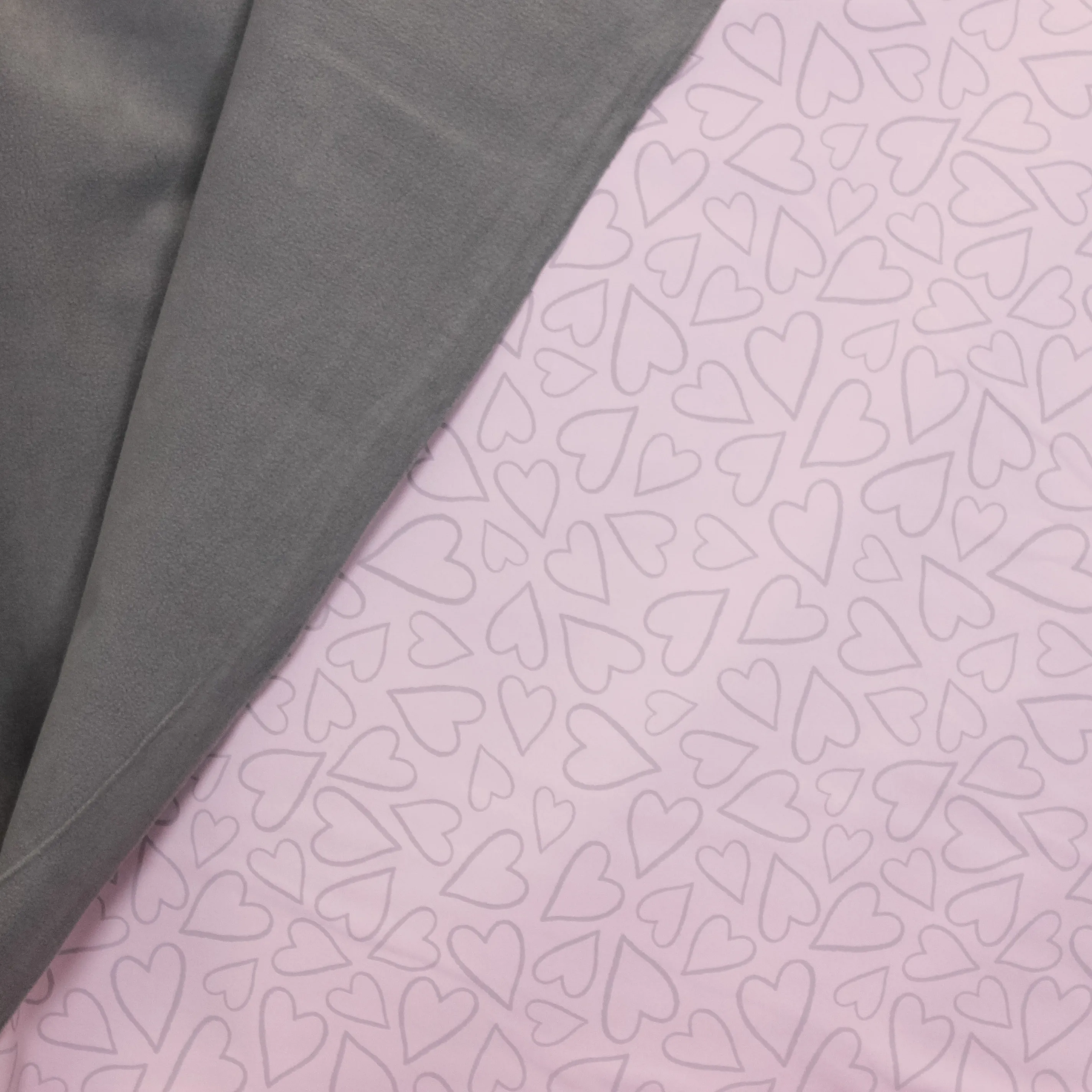 Reflecterende roze softshell met grijze achterkant, print met hartjes