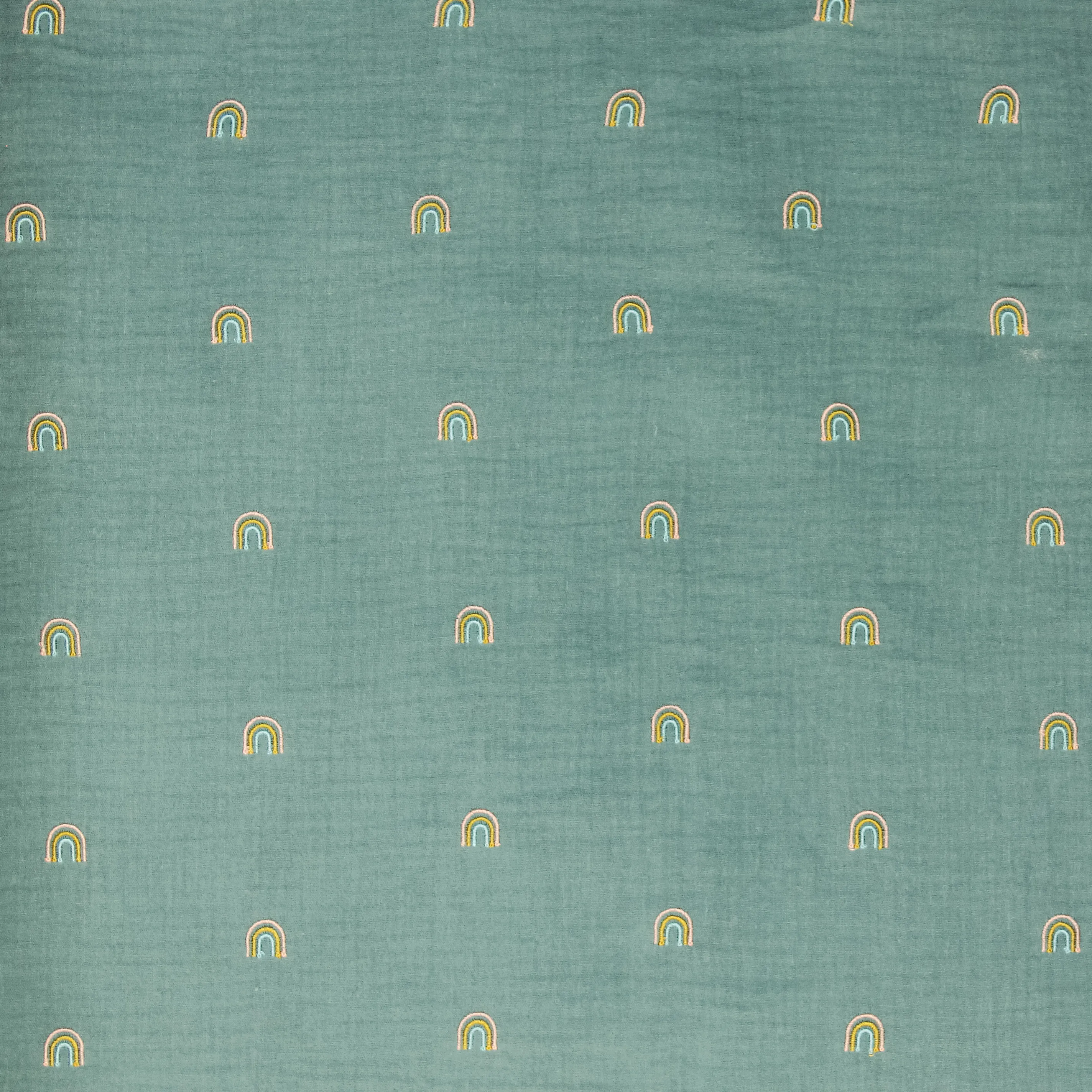 Blauwgroene double gauze met geborduurde regenbogen