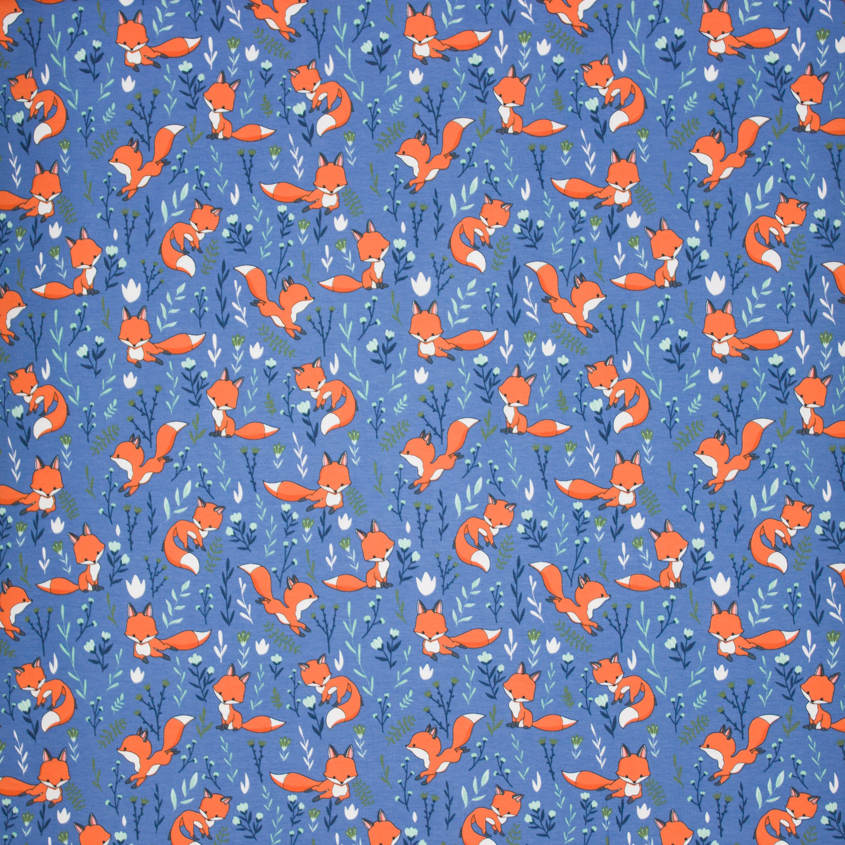 Blauwe tricot met vosjes en planten