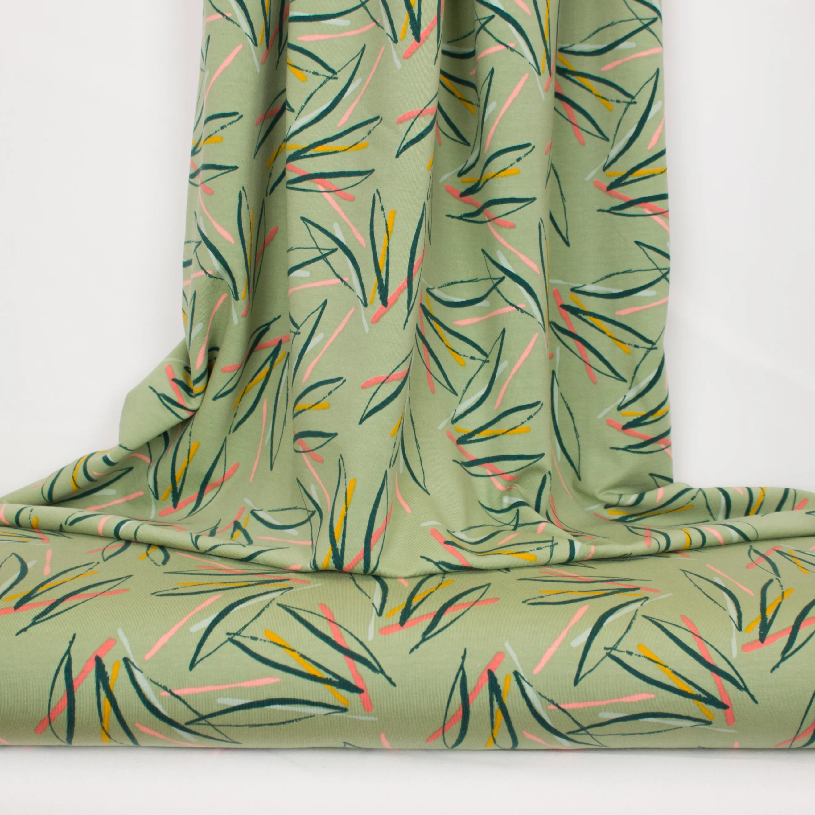 Licht groene french terry met blauwe, oranje, peach strepen van Poppy