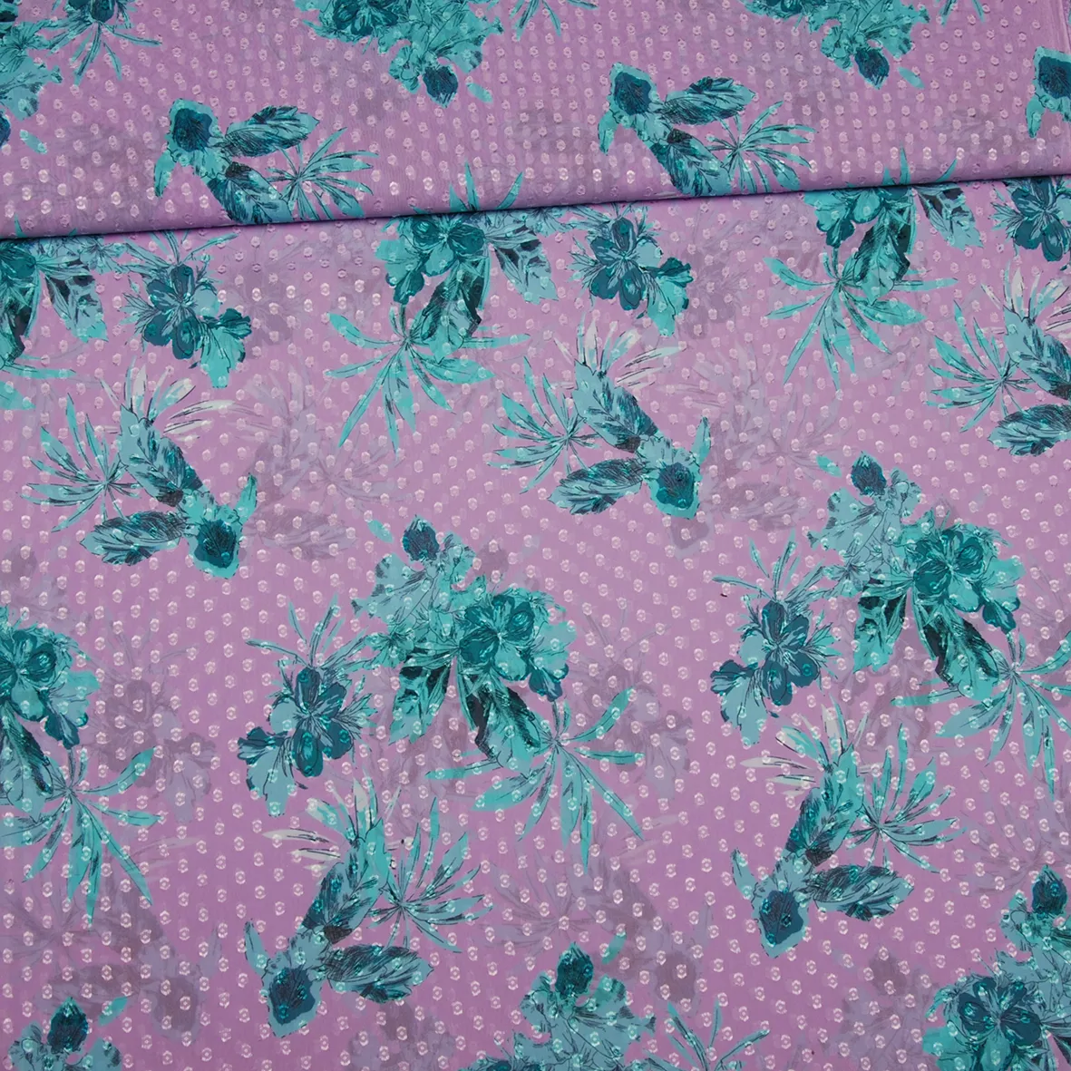 Lila polyester voile met turquoise bloemen van Knipmode