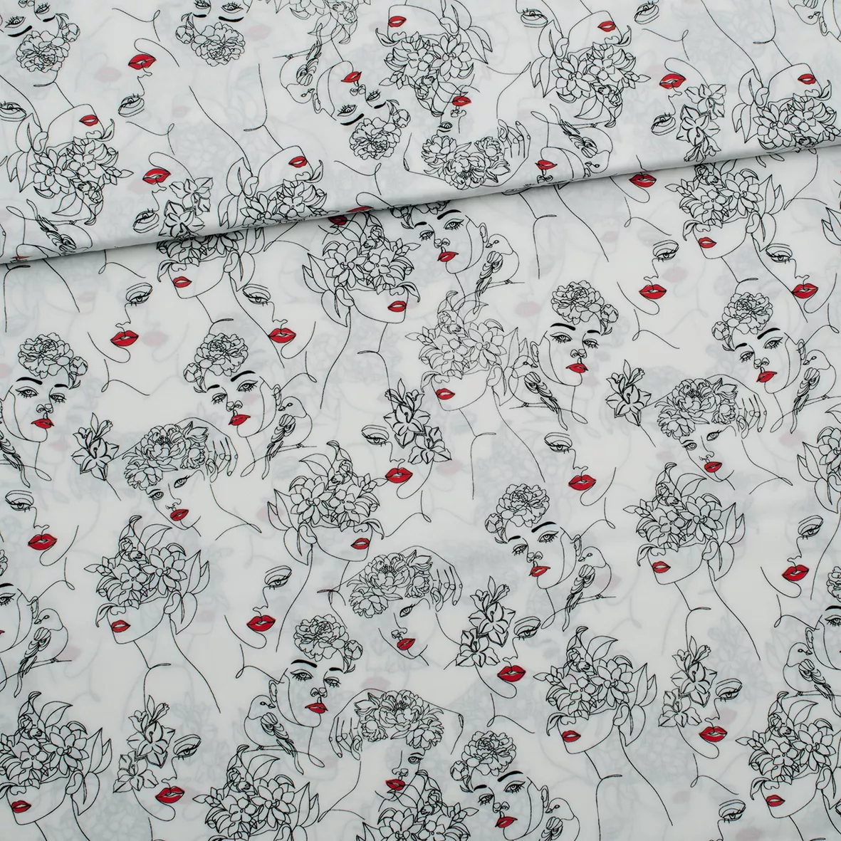 Witte viscose met sierlijke gezichten in zwart en rood