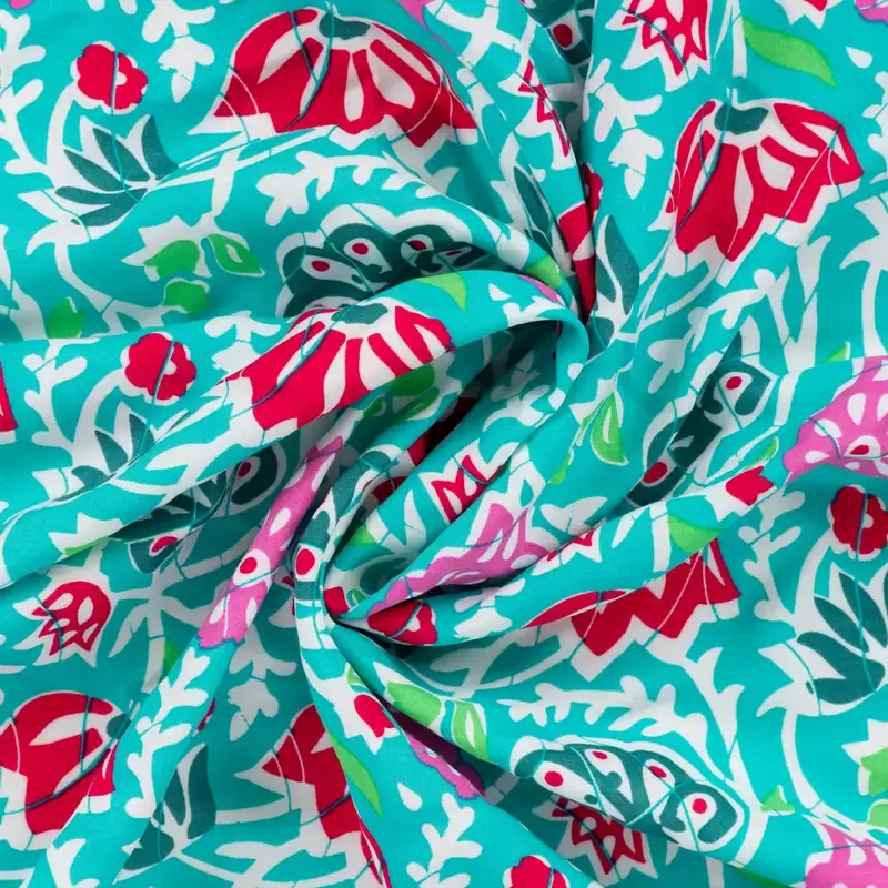 Viscose voile turquoise met bloemen